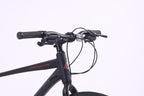 Close-up of the handlebars and cables of the 6725 Axis 700c Commuter Bike, showcasing its sleek design.