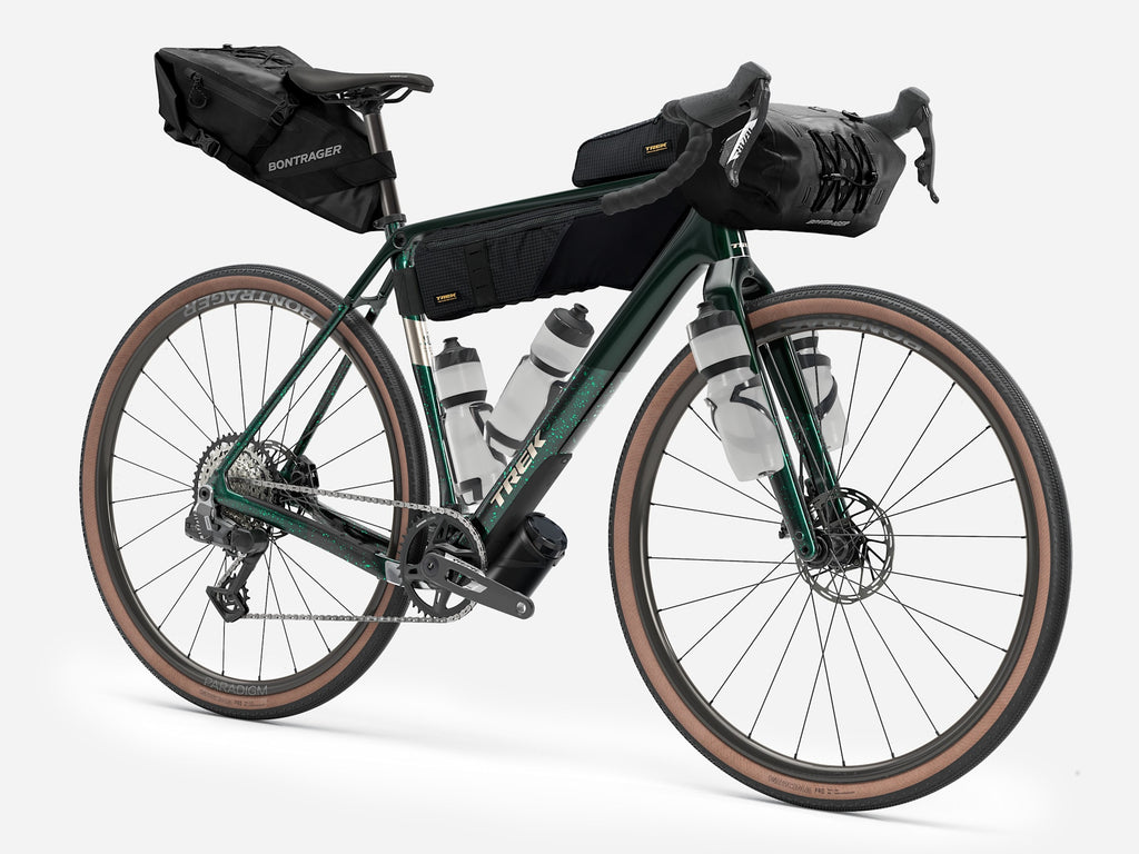 2027 Trek Checkpoint SL 6 AXS carbon gravel bike fitted with bikepacking bags and bottle cages