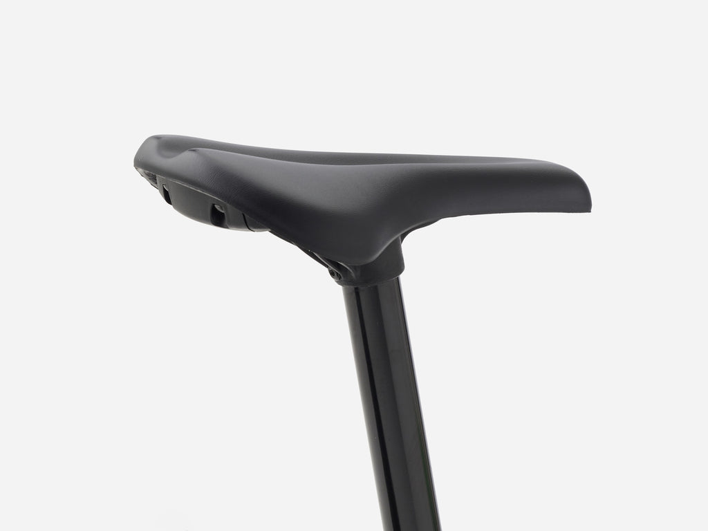 close-up of padded kids saddle and seatpost on 2027 Trek Precaliber 24 suspension kids bike