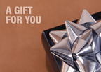 Metallic gift bow with text 'A Gift For You' on a brown background